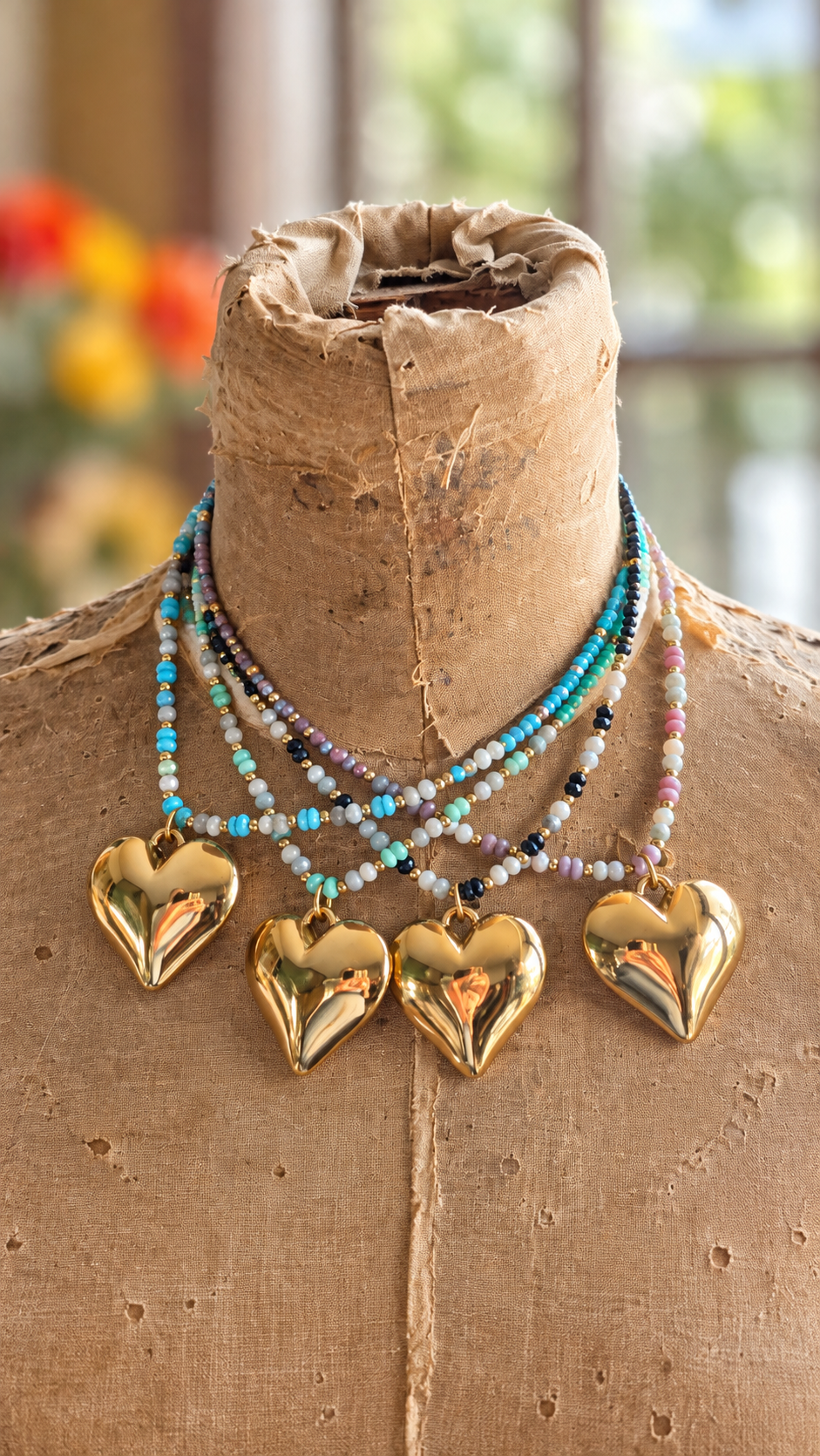Crystal beaded necklace with gold plated heart pendant