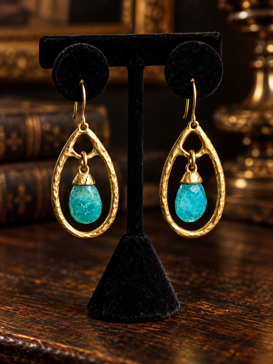 Natural apatite teardrop earrings on black velvet display