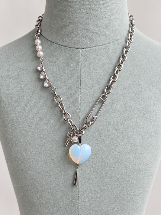 Stainless steel opalite heart necklace on neutral mannequin